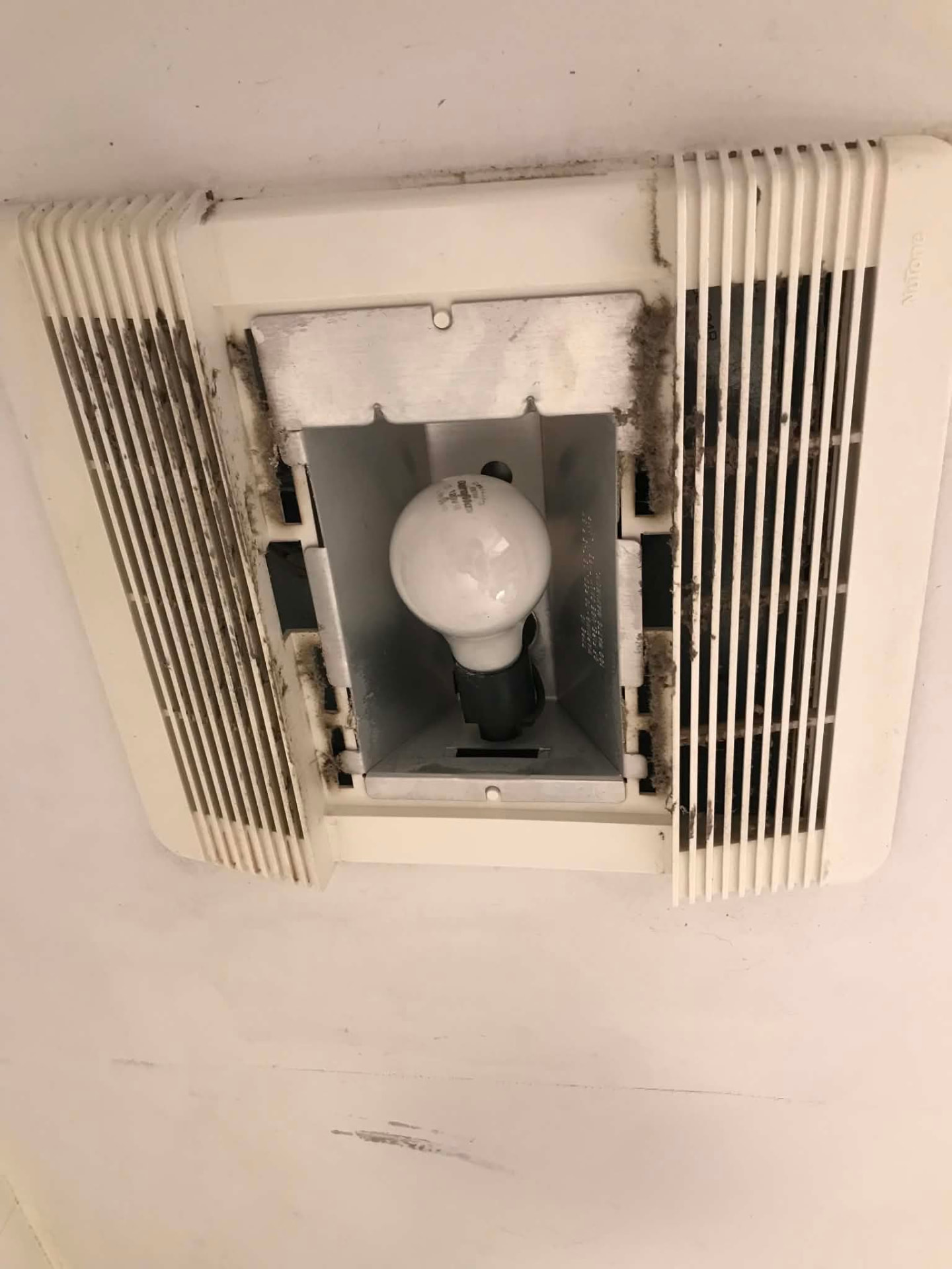 Bathroom ceiling fixture before cleaning