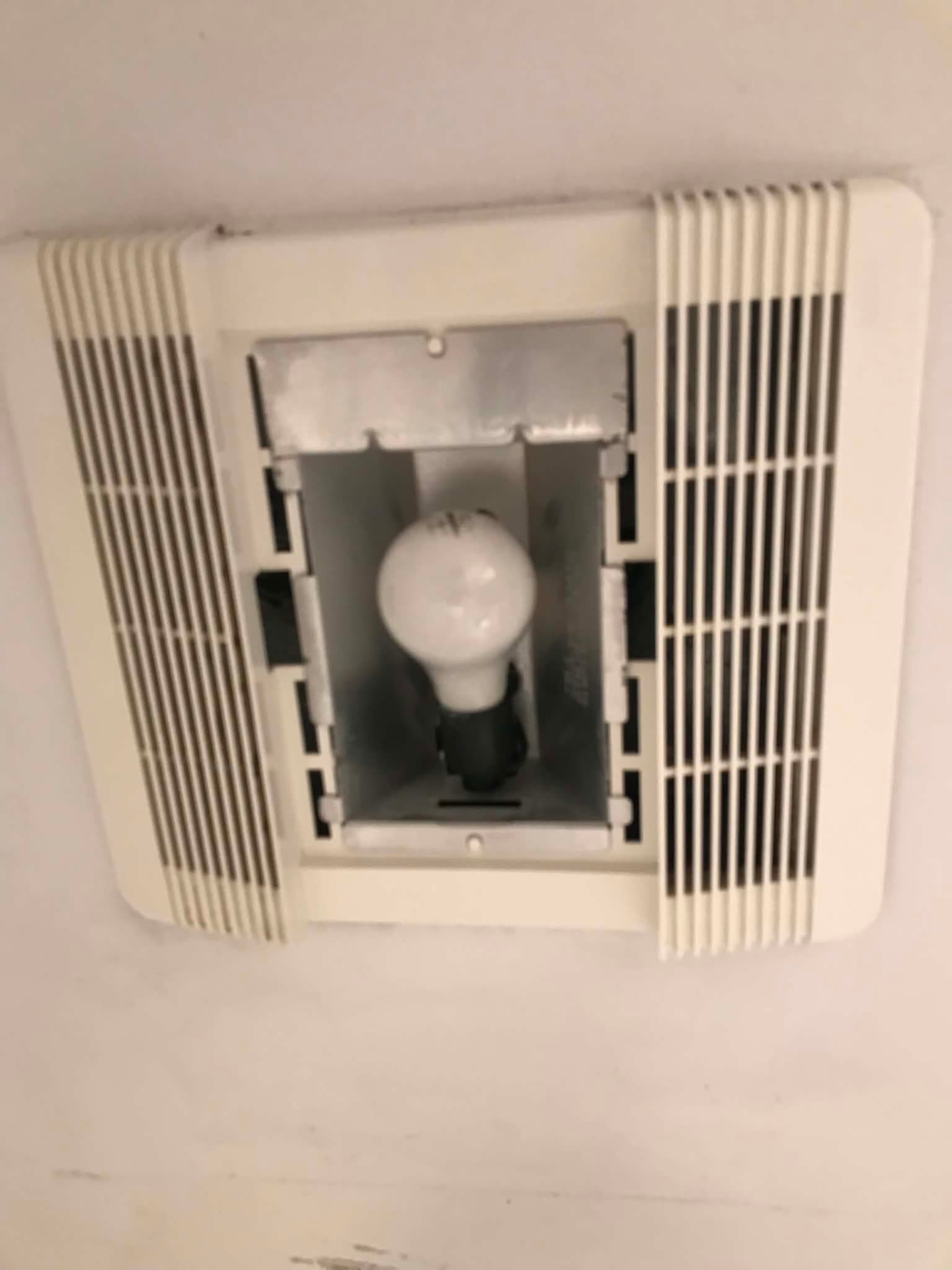 Bathroom ceiling fixture after cleaning